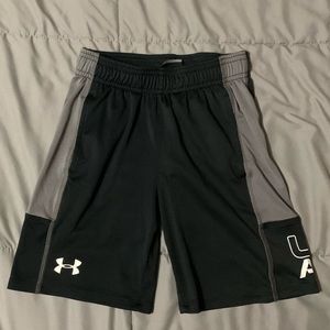 Black, gray, and white under armour shorts. Size 6